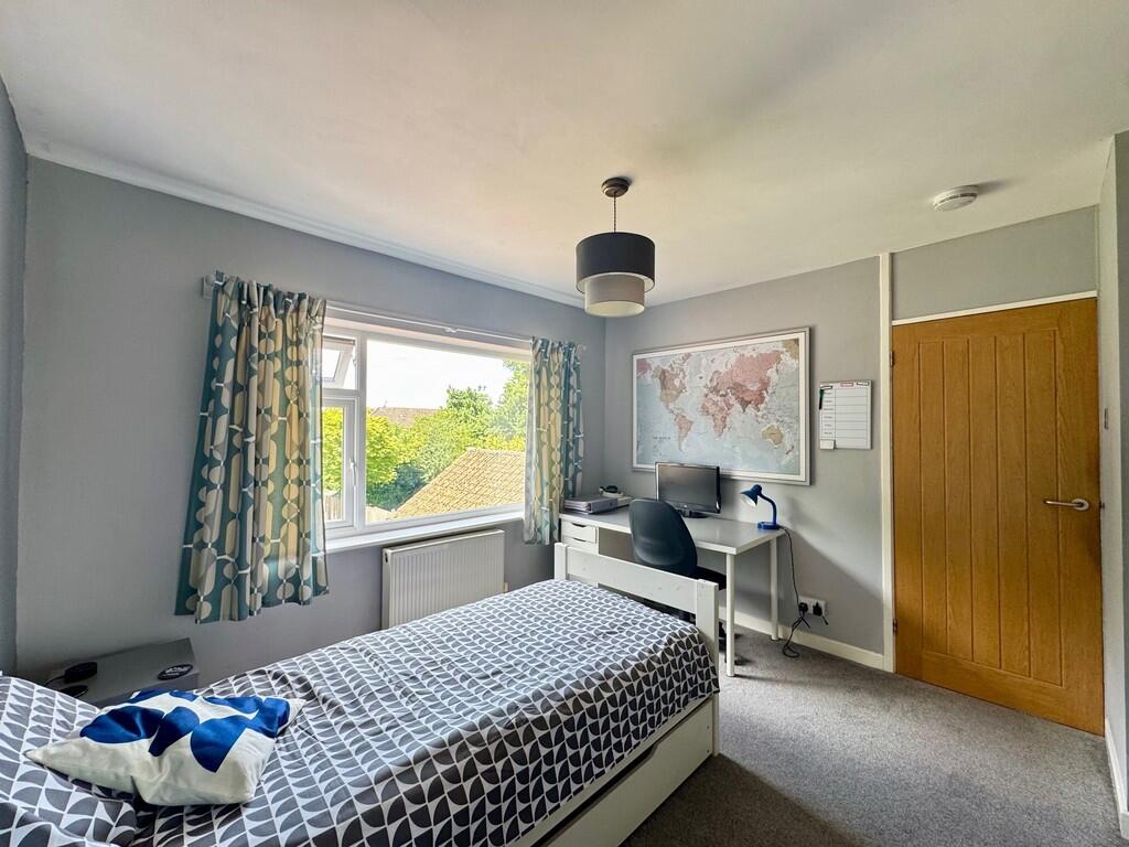 Bedroom with Wind...