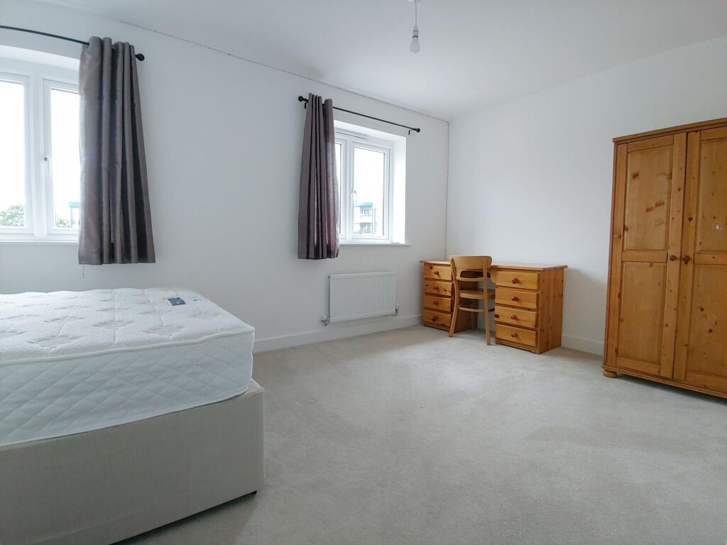 Bright, airy master bedroom with two windows, n...