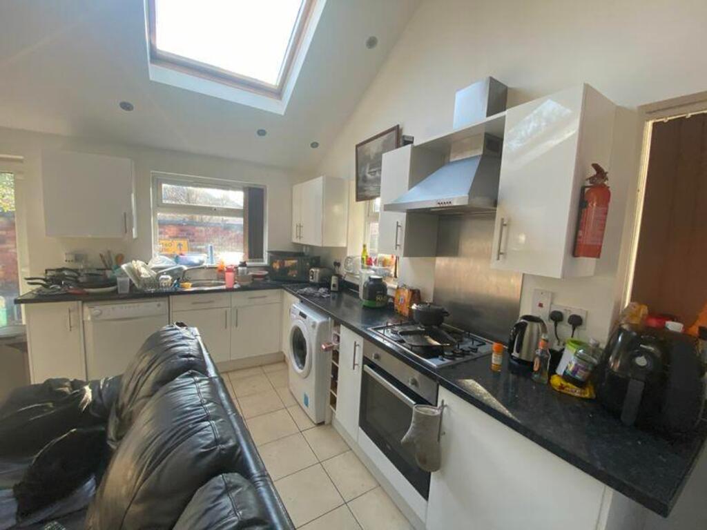 A bright and functional kitchenette with modern...