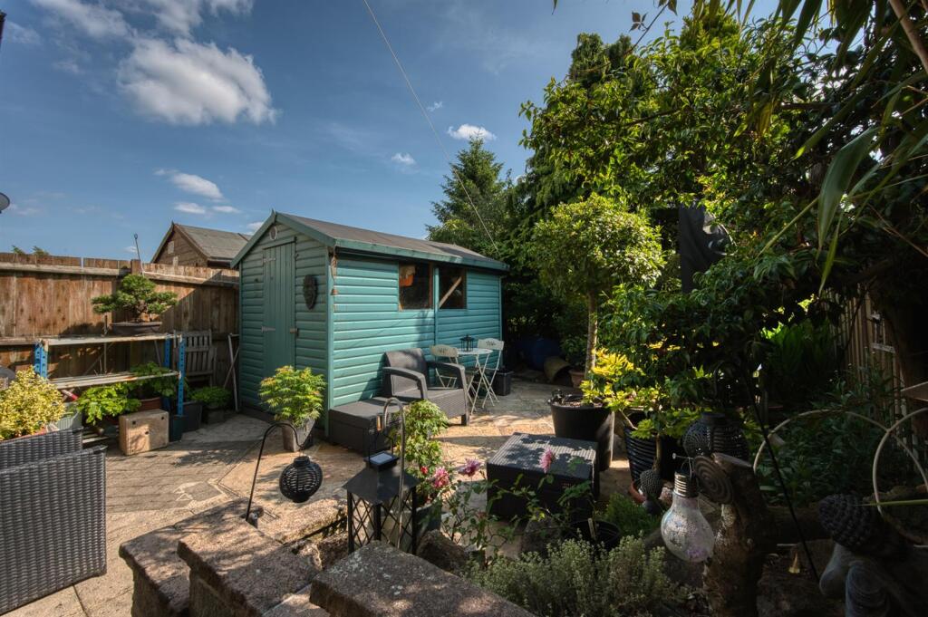 Rear Garden - large shed and lower patio.jpg