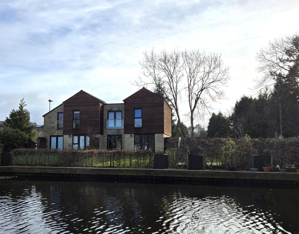 Across from the canal, the rear garden views