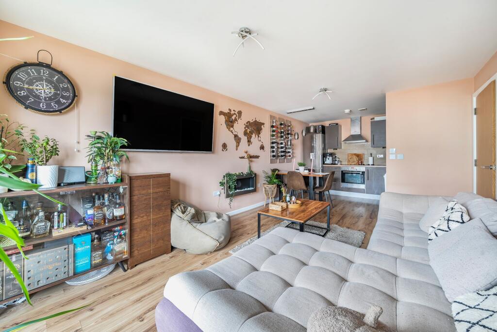 Open plan living space with balcony