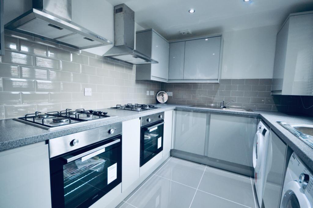 A modern and tidy kitchen equipped with high-qu...