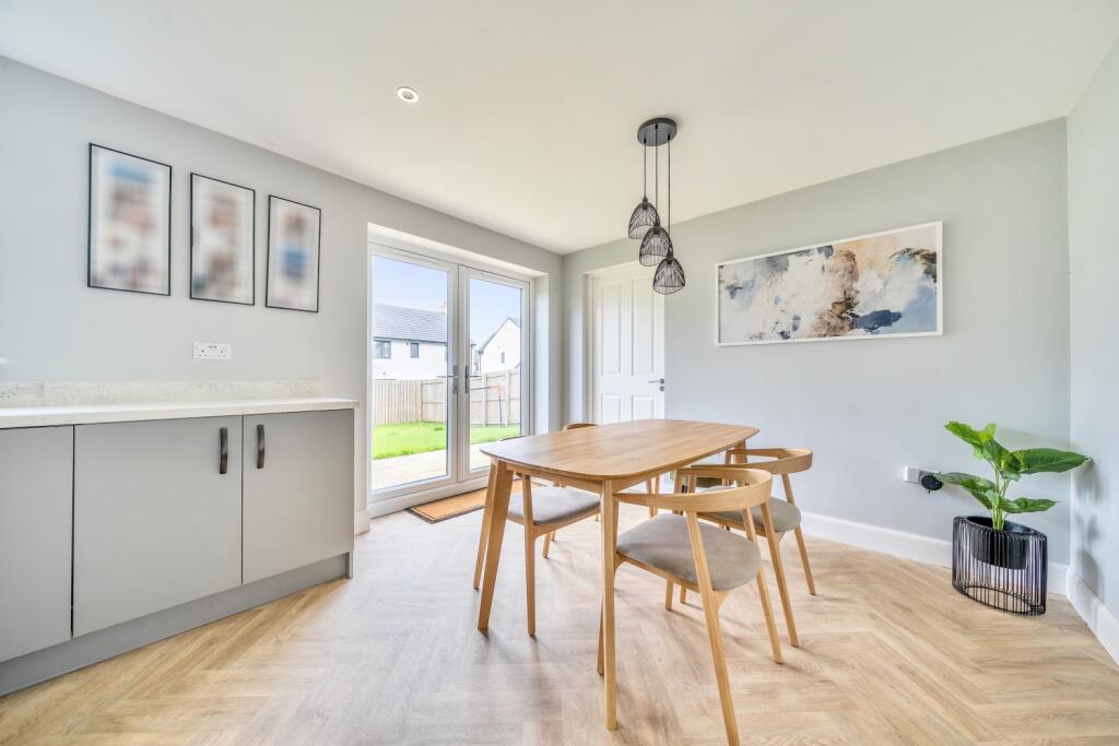 Dining area showing access door to garage
