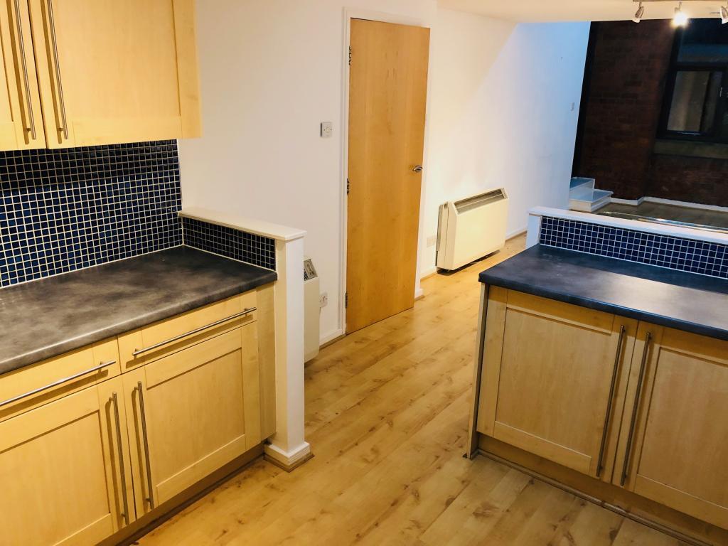 Large Kitchen leading to lounge area