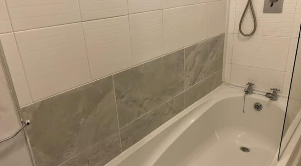A clean and modern bathroom featuring a white b...
