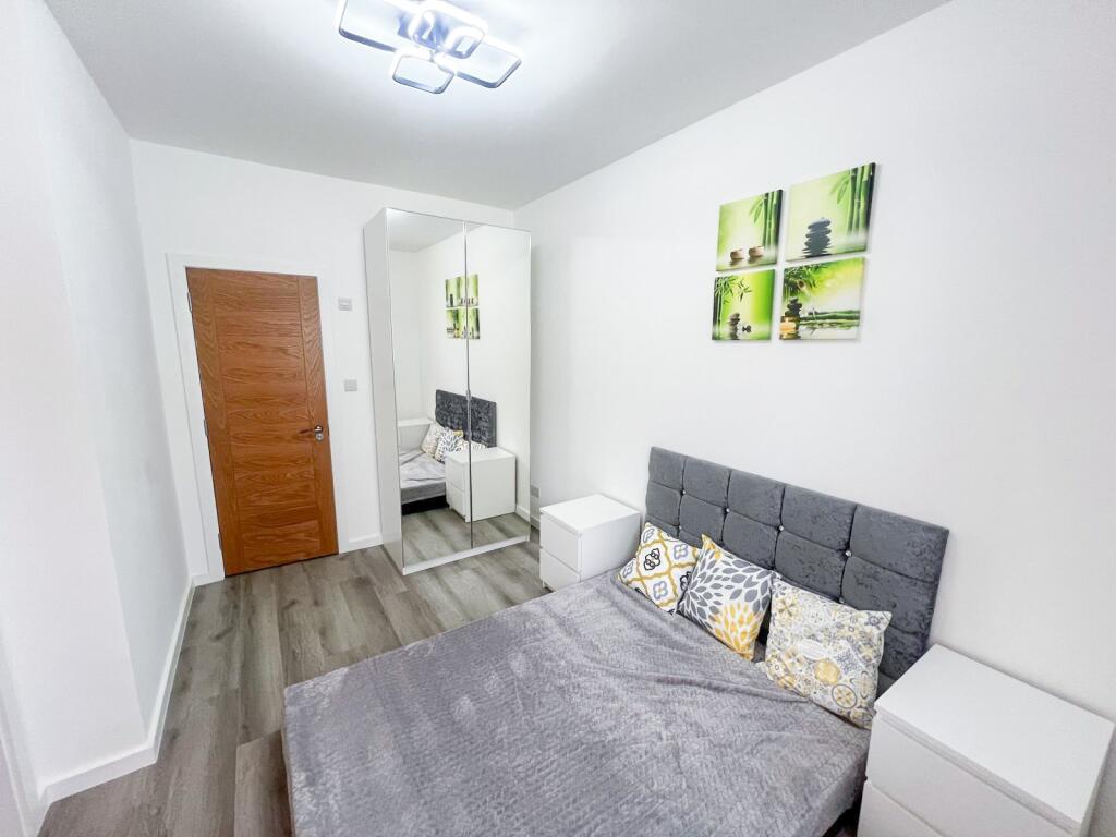 Bright and tidy double bedroom featuring a comf...