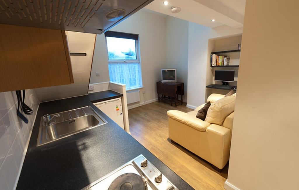 This charming kitchen area features modern appl...