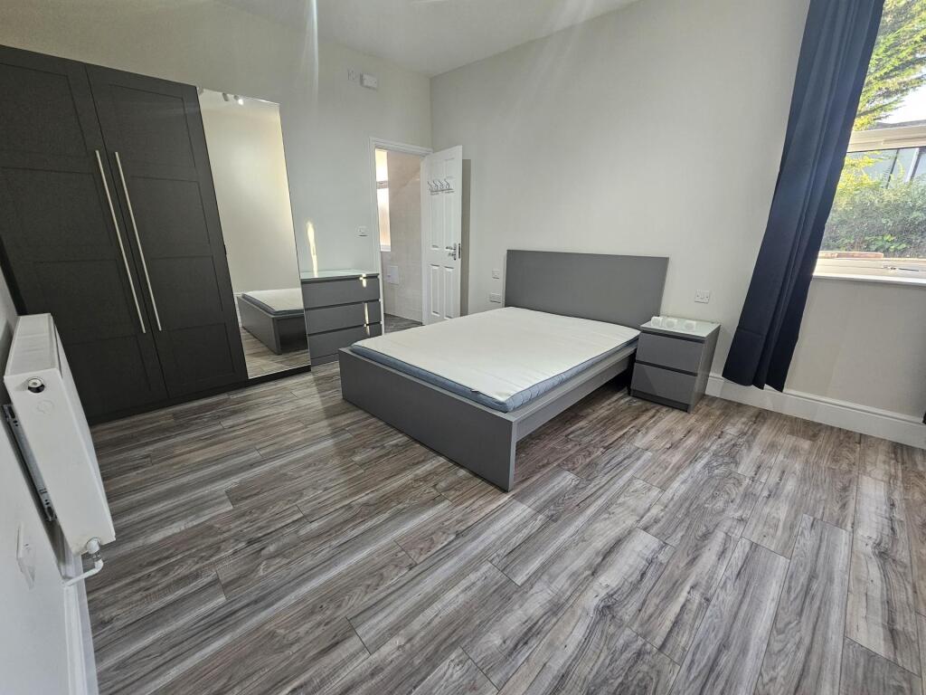 Bright and modern double bedroom featuring slee...