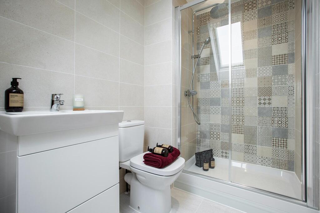The en-suite features a large double shower