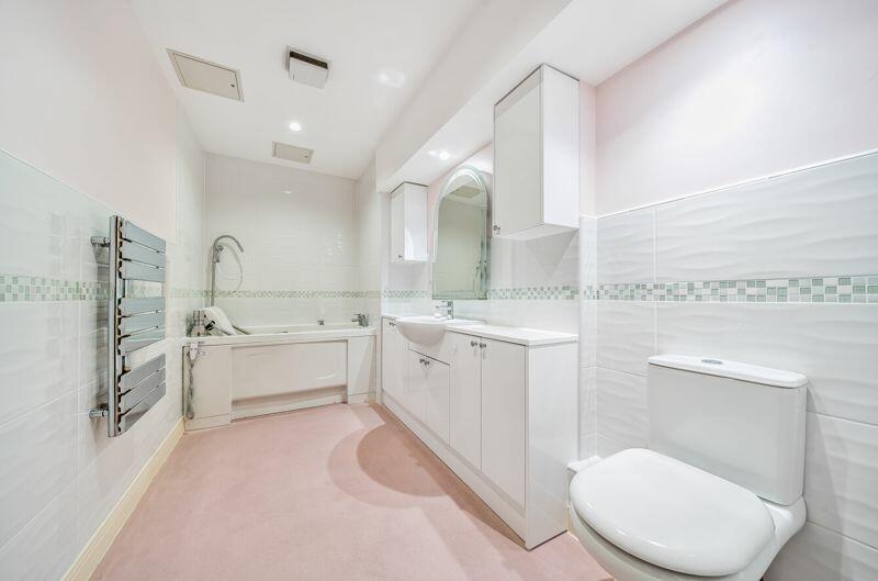 Bathroom with adapted bath