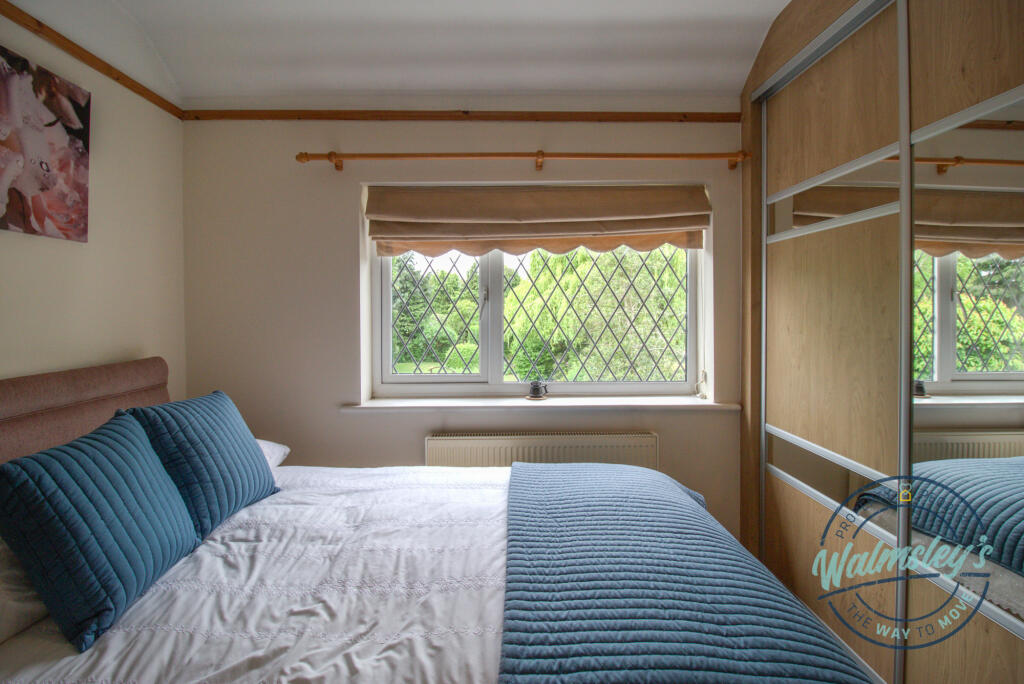 Bedroom three overlooking gardens