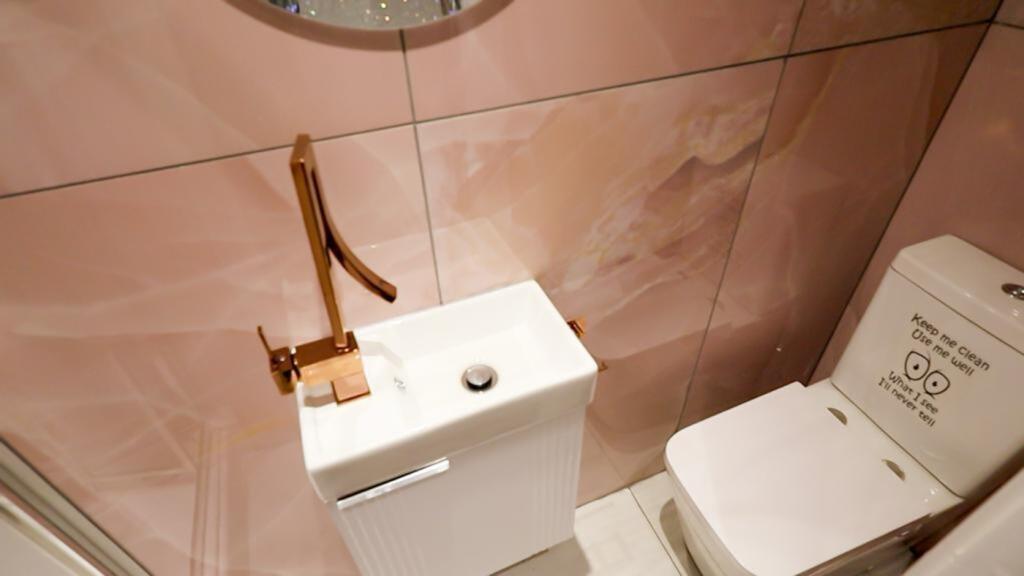 A stylish and modern single toilet with elegant...