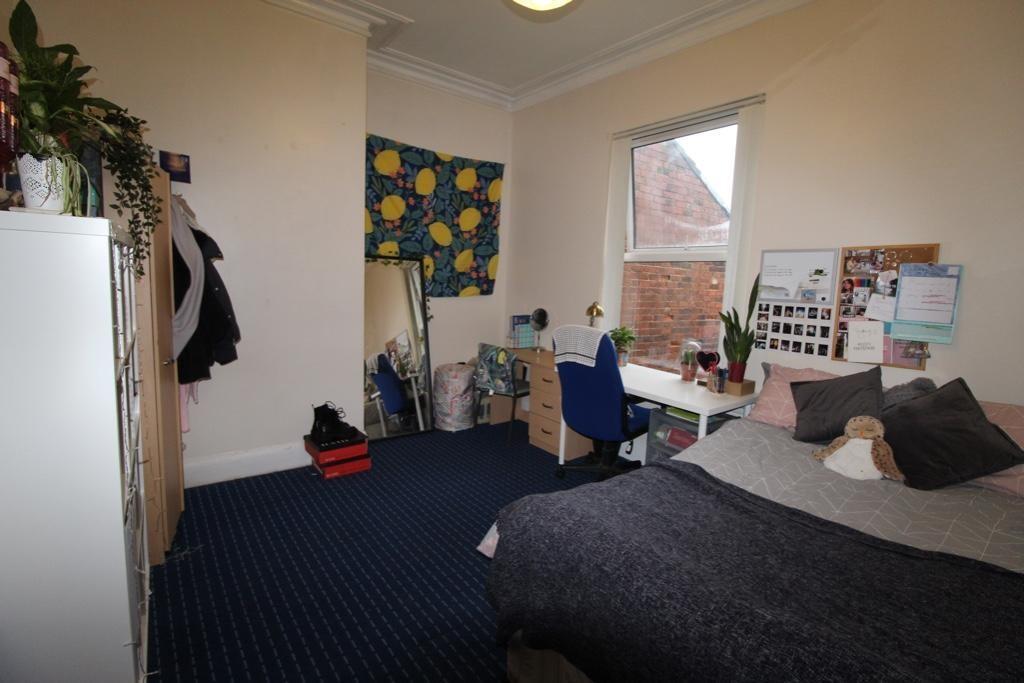 Bright furnished double bedroom with a comforta...