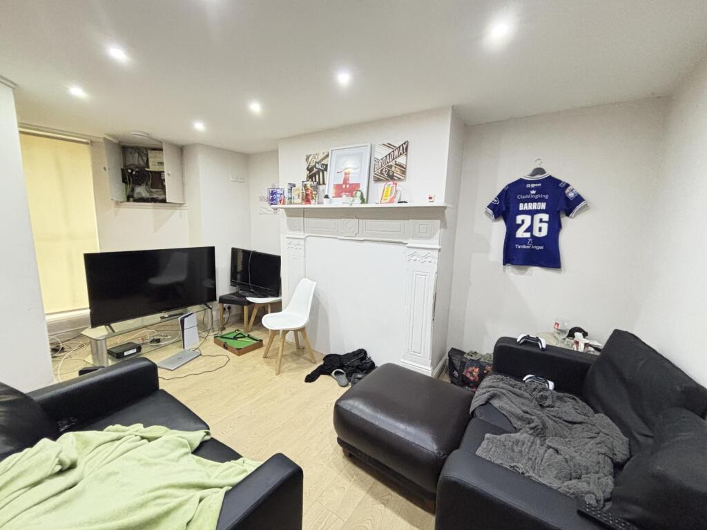 A bright and spacious living room featuring mod...