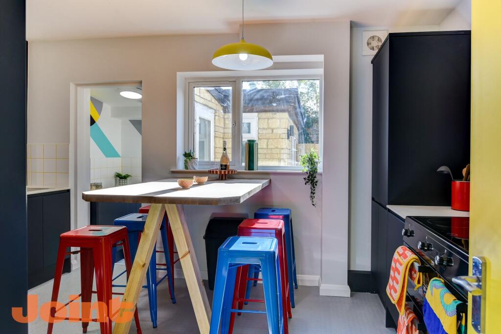 A modern kitchen featuring a spacious layout wi...