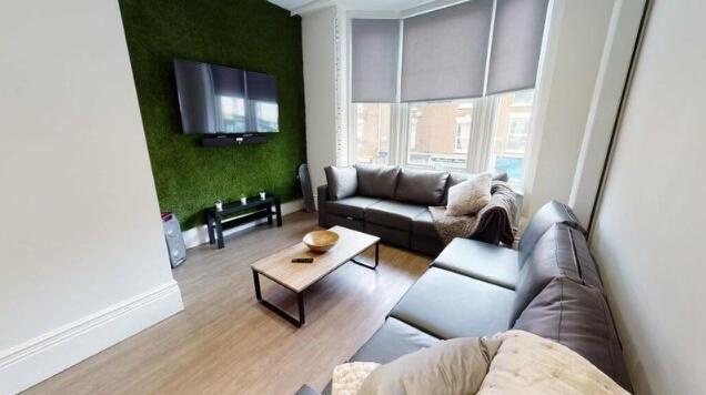 A modern living room featuring two large, comfo...