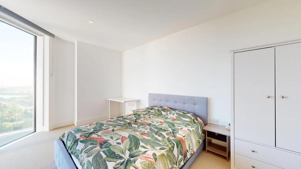 Bright and spacious master bedroom featuring a ...