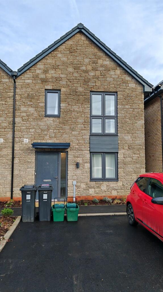Charming front view of a modern terraced house ...