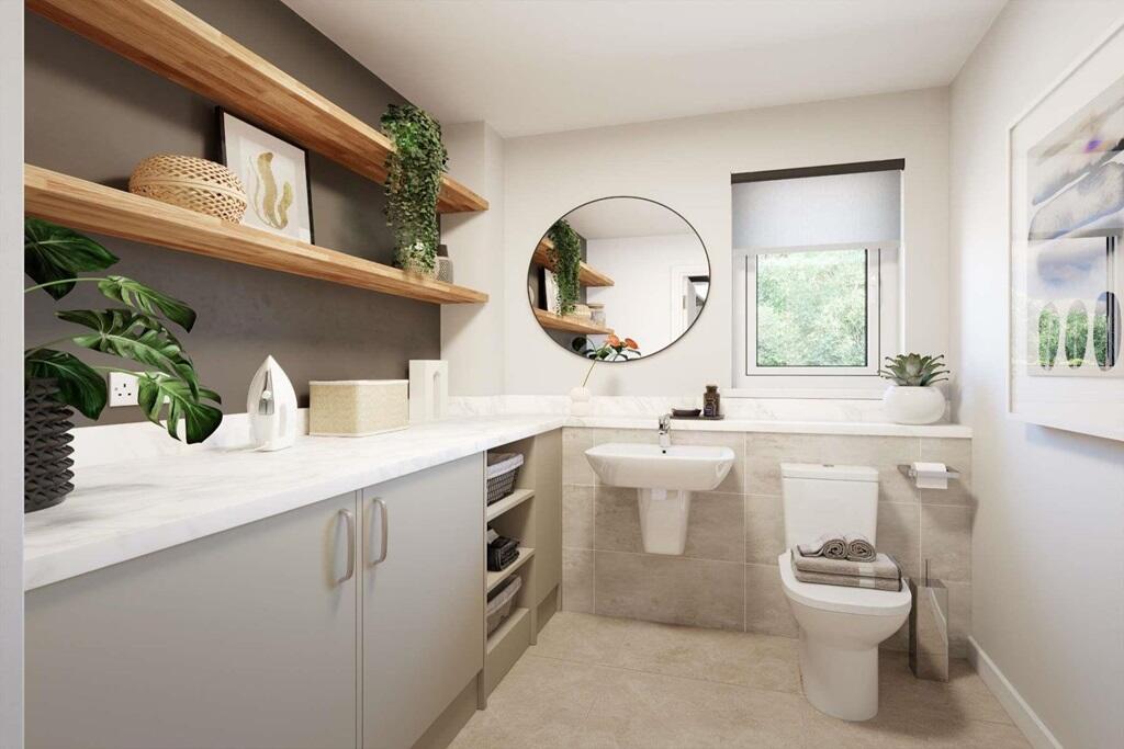 A handy utility/WC sits off the hallway