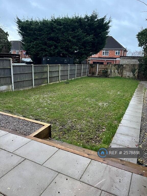 Back Garden With Patio Area And Lawn