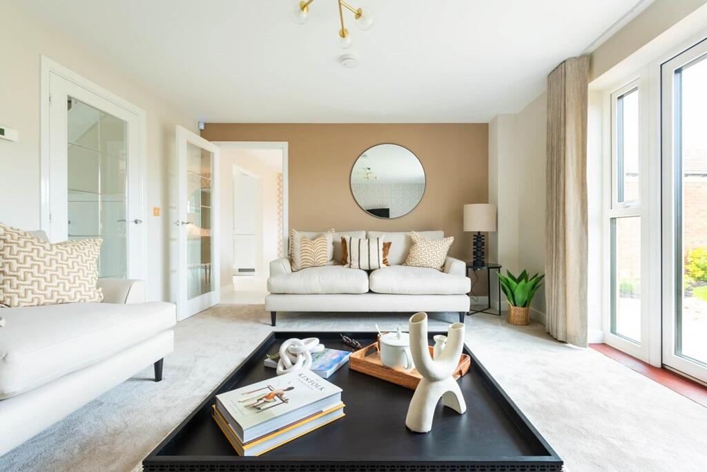 Open plan lounge with French doors opening to the garden