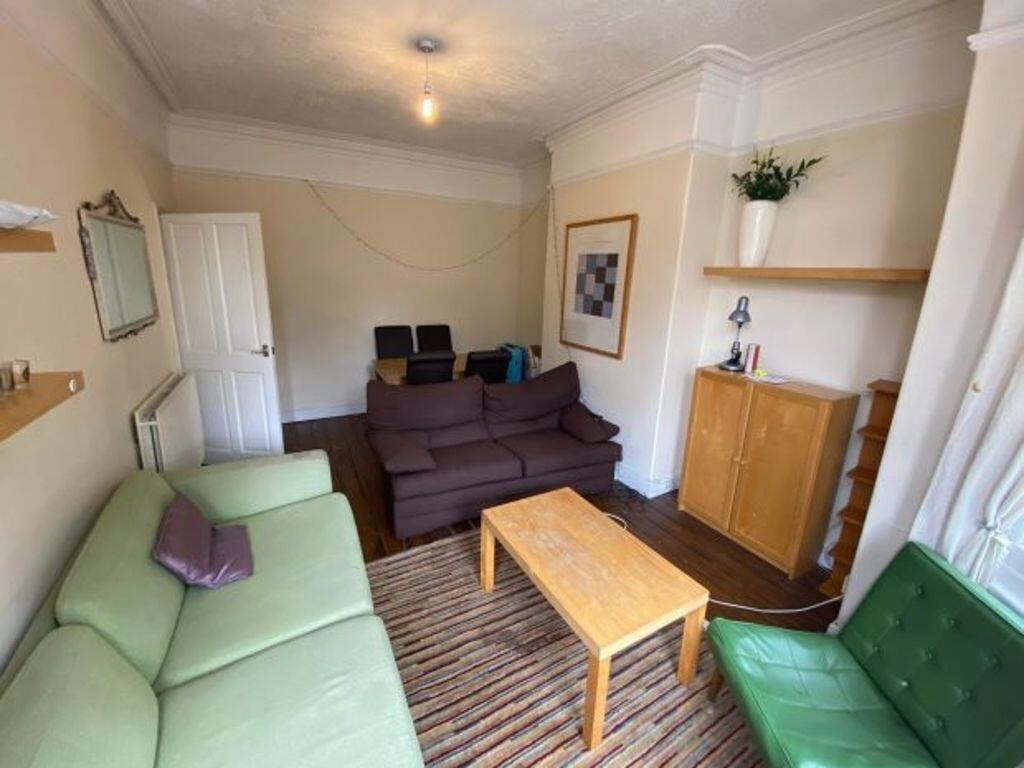 A bright and welcoming living room with comfort...