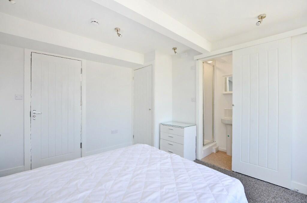 Bright and inviting master bedroom featuring a ...