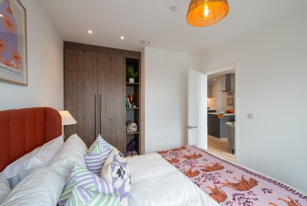 Bright and cozy double bedroom featuring a comf...