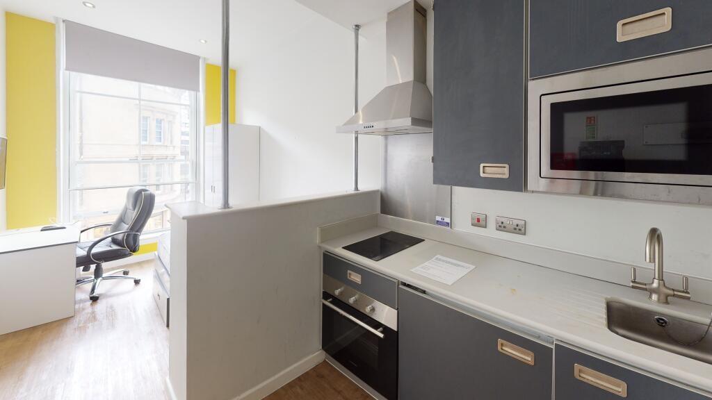 Bright and modern kitchen area featuring sleek ...
