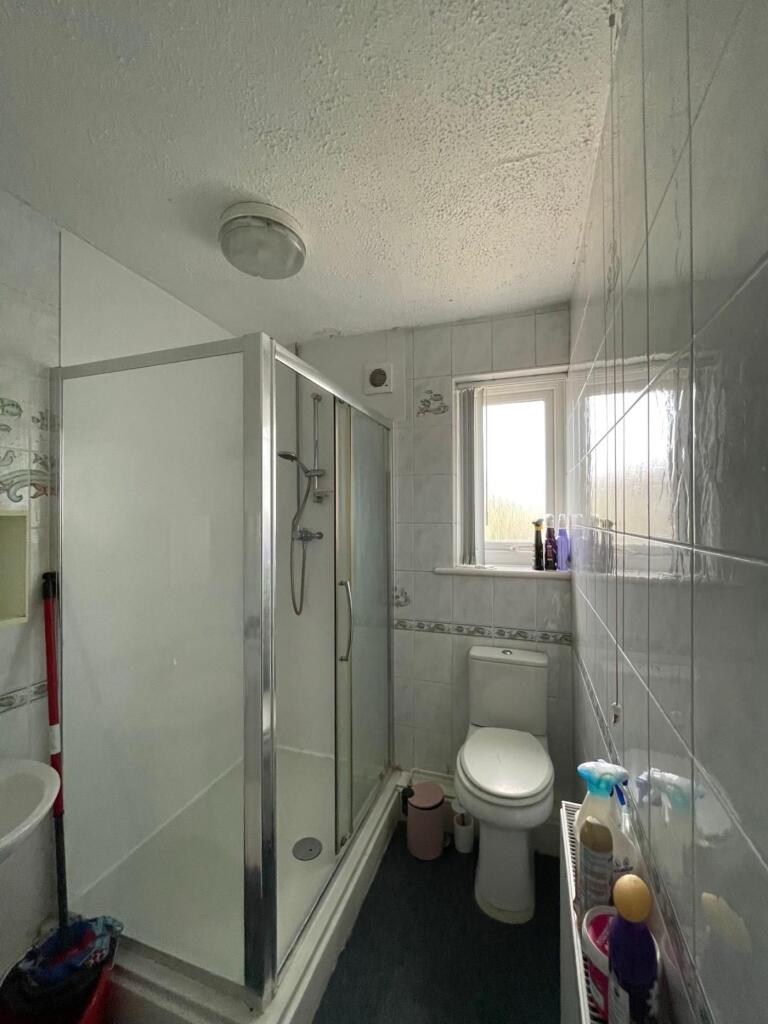 A well-maintained bathroom featuring a modern s...