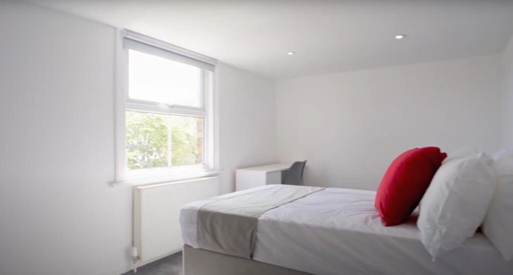 Bright and inviting double bedroom featuring a ...