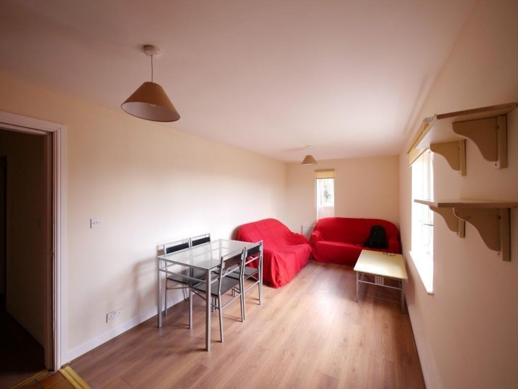 A cozy living room with natural light streaming...