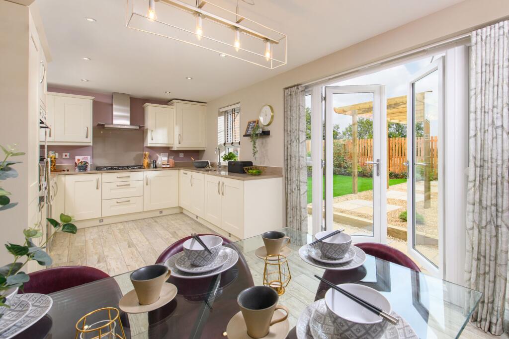 Open-plan dining kitchen looking onto garden