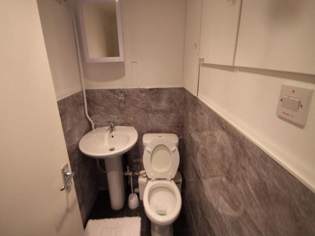 A clean and functional small bathroom featuring...