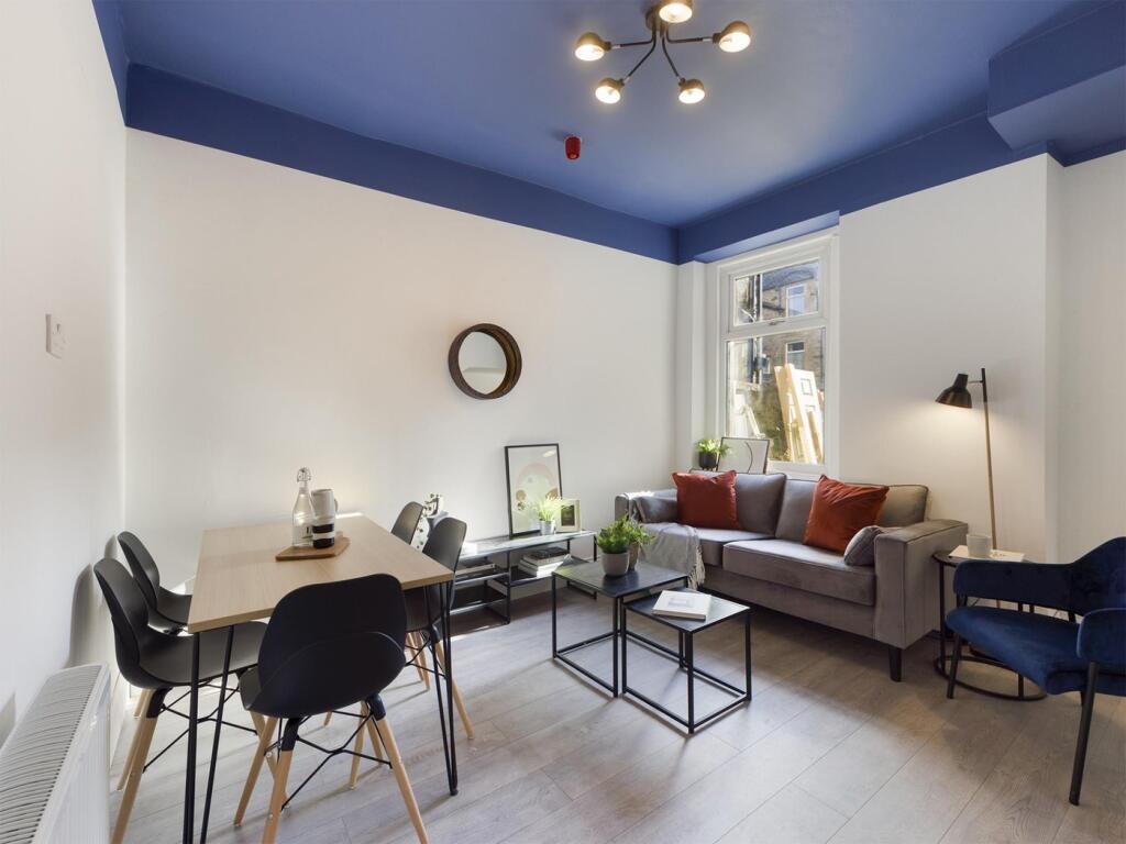 A spacious and stylish modern living room with ...