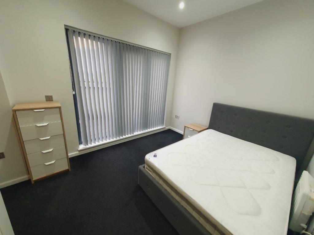 bedroom with en-suite and balcony