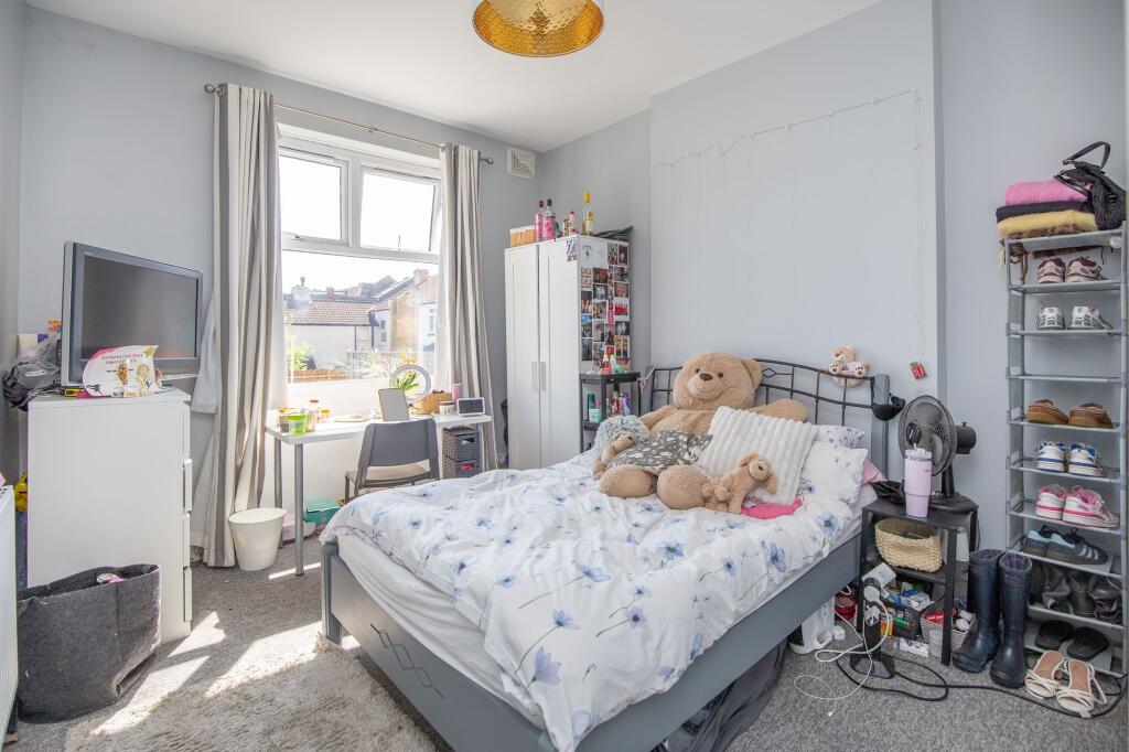 Bright and cozy double bedroom featuring a larg...