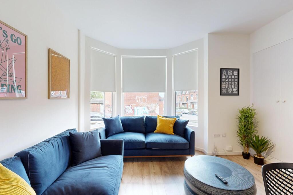 A bright and inviting living room featuring a m...