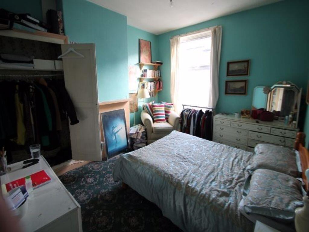 A cozy double bedroom featuring a comfortable d...