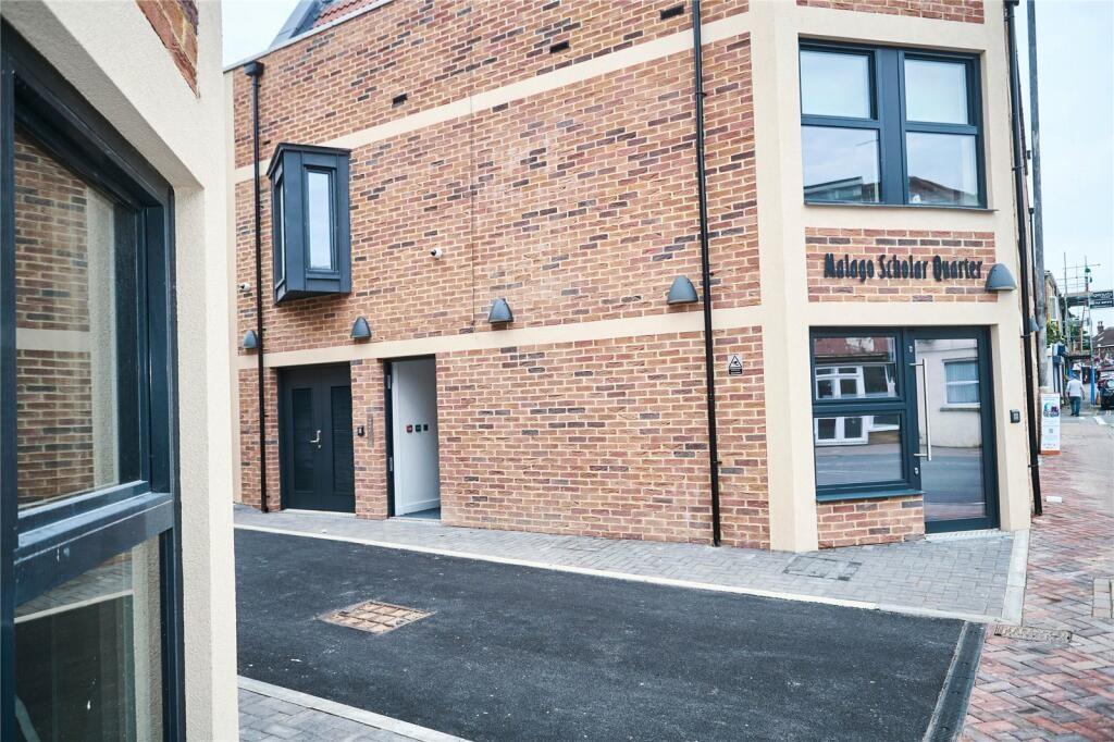 Well-maintained front of a modern terraced prop...