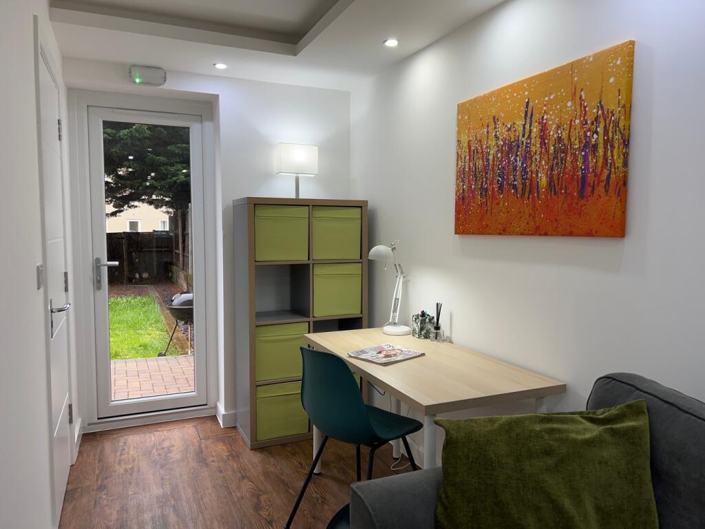A bright and inviting living room featuring a s...