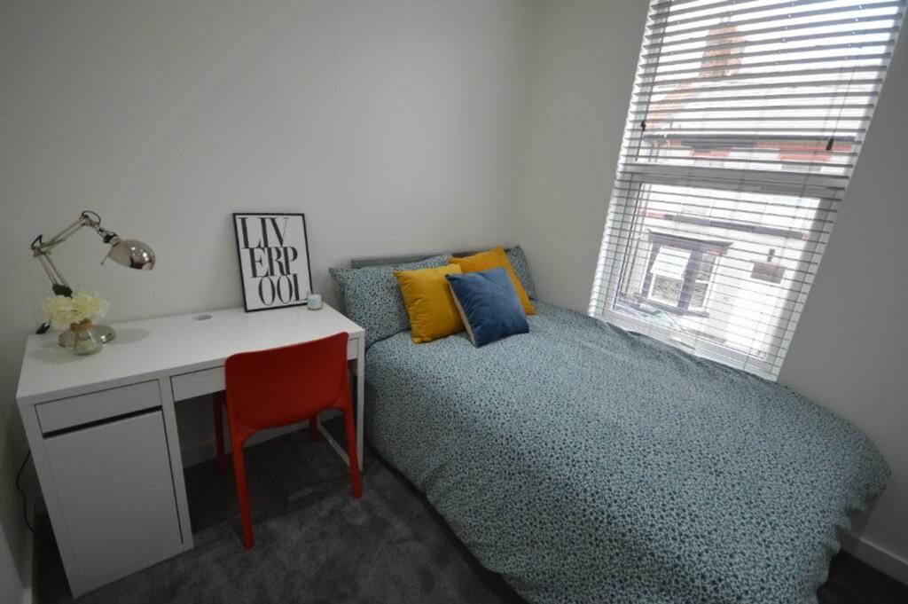 Bright and inviting double bedroom featuring a ...