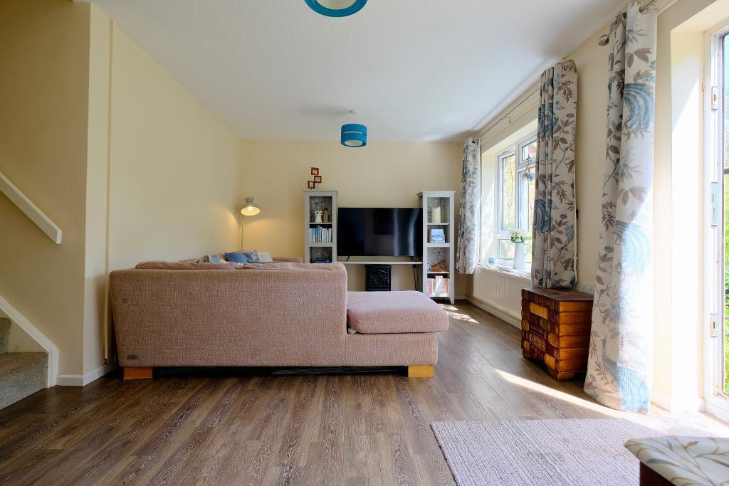 S facing sitting room, door to garden