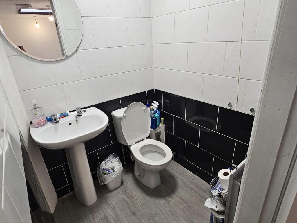 A clean and spacious bathroom featuring a large...