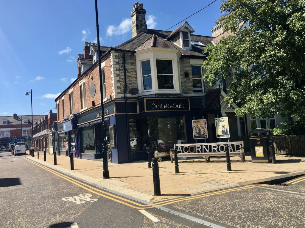 A charming corner pub with traditional brick an...