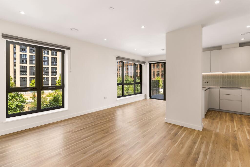 Experience city living in this sleek apartment, bathed in natural light.
