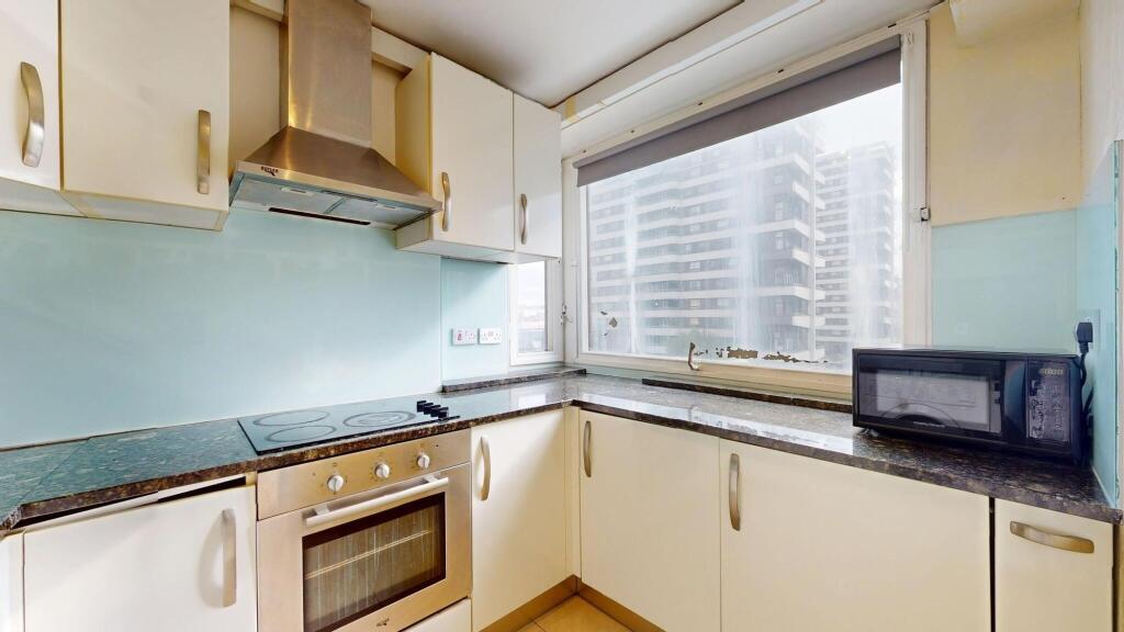 A bright kitchen with ample natural light from ...