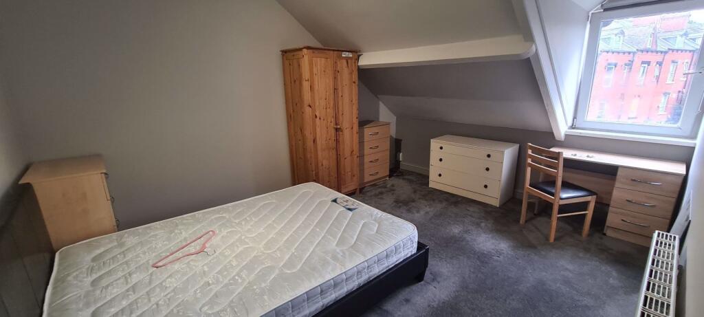 A cozy double bedroom featuring a comfortable m...