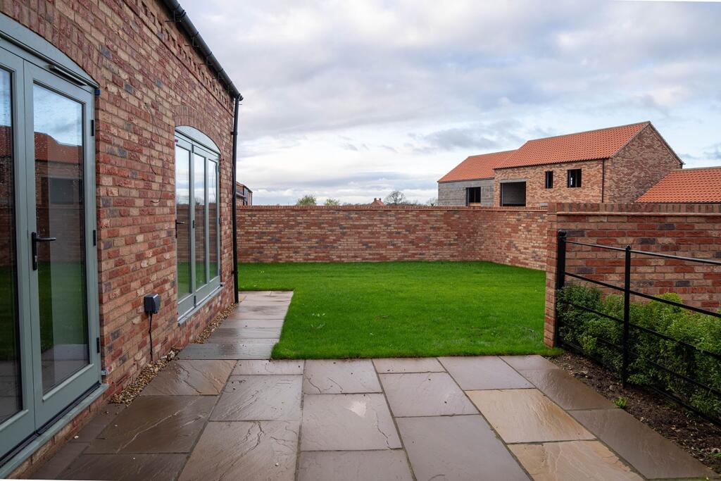 Walled garden with York stone patios